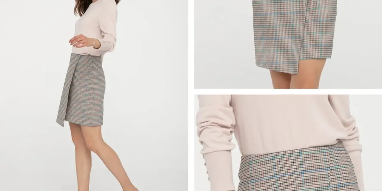 Kratka na spódniczce to ponadczasowy trend. Modelka prezentuje stylową, asymetryczną spódniczkę w kratkę, która z pewnością jest modna.
