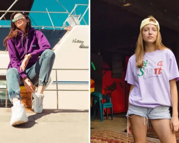 Dwie kobiety w modnych stylizacjach streetwear. Jedna w fioletowej bluzie i jeansach, druga w liliowej koszulce z napisem "Pizza Sport". Polskie marki odzieżowe streetwear w akcji.