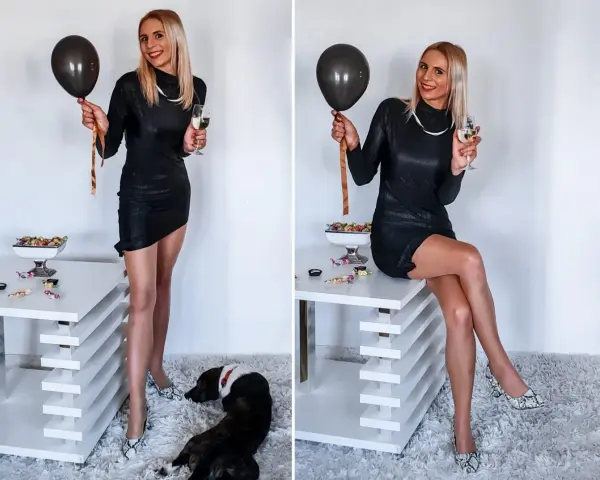 Elegancka czarna sukienka, idealna na 18 urodziny syna. W dłoni balon i kieliszek szampana.